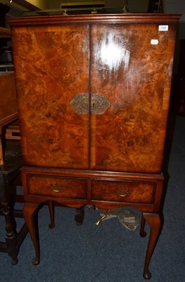 Lot 1488 - A walnut drinks cabinet