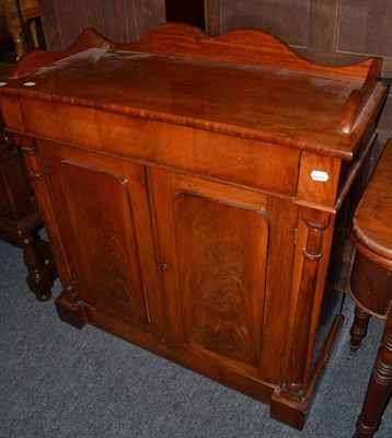 Lot 1496 - A Victorian flame mahogany chiffonier, with reduced gallery back and enclosed by two doors with...