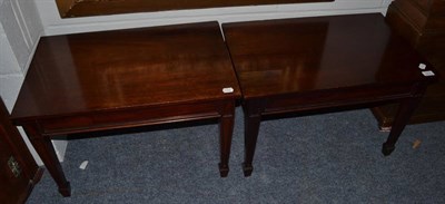 Lot 1514 - A pair of mahogany side tables/luggage stands