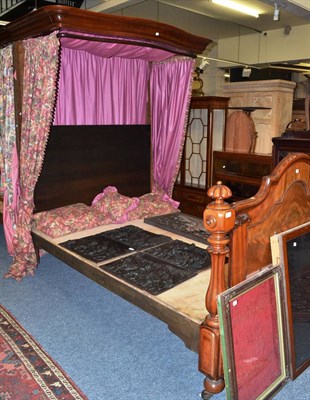 Lot 1530 - A Victorian figured mahogany half tester bed with moulded canopy surround and shaped footboard