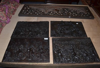 Lot 1532 - A pierced oak panel with carved shield to the centre and four carved oak decorative figural...