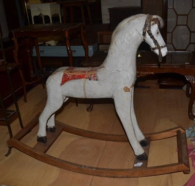 Lot 1533 - A 19th century painted rocking horse on a sledge base