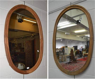 Lot 1544 - Pair of oak framed oval mirrors