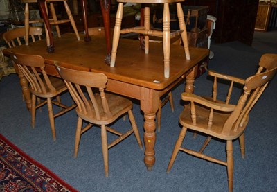 Lot 1551 - * A pine kitchen table fitted with a single drawer, 183cm wide together with eight pine kitchen...