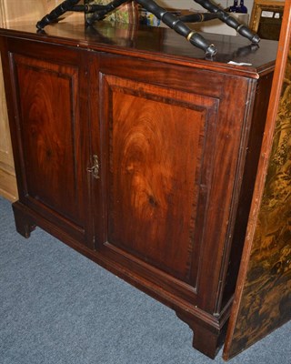 Lot 1565 - A 19th century mahogany press cupboard