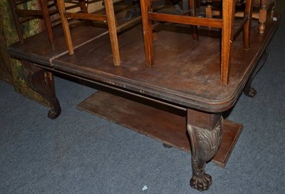 Lot 1570 - A Victorian carved mahogany extending dining table on acanthus carved cabriole legs, originally...