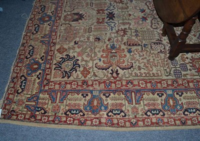 Lot 1573 - Tabriz carpet, Persian Azerbaijan, the cream field of angular vines and stylised palmettes enclosed