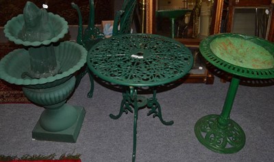 Lot 1582 - Aluminium bistro garden table and two chairs, cast iron bird bath, green painted and cast metal two