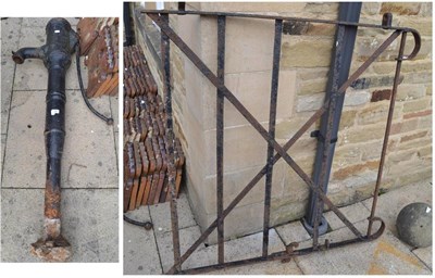 Lot 1585 - Metal garden gate, a Victorian metal water pump and a Grind stone (3)