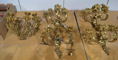 Lot 1599 - Set of four ormolu wall lights and a six branch candelabrum (lacking base)