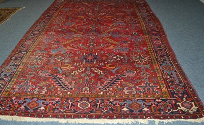 Lot 1612 - Heriz carpet, Persian Azerbaijan, the blood red field with an allover design of serrated leaves and