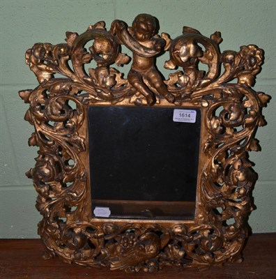 Lot 1614 - A 19th century carved giltwood florentine style pier glass, with a phoenix, cherub and scroll...