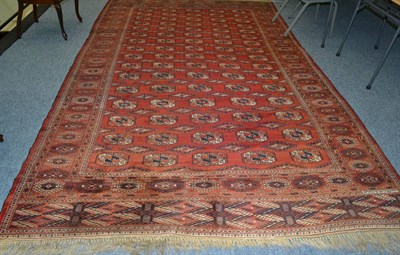 Lot 1615 - Tekke Turkmen carpet, North West Afghanistan, The madder field with five columns of quartered...