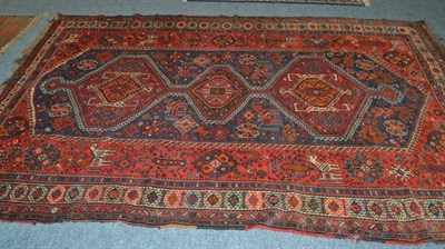 Lot 1617 - Kashgai carpet, South West Persia, the indigo lozenge field with three linked medallions surrounded