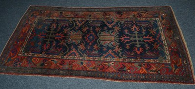 Lot 1621 - Hamadan rug, Persian Kurdistan, the indigo field with large stylised flowerheads enclosed by...