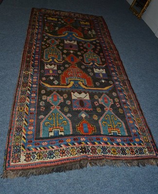 Lot 1623 - Kurdish Kerabagh rug, South Caucasus, the field with large polychrome tribal motifs enclosed by...