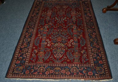 Lot 1628 - Tabriz Prayer rug, Persian Azerbaijan, the madder field with floral sprays beneath a Mihrab flanked