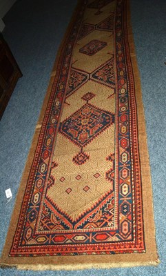 Lot 1630 - Narrow pair of Sarab runners, Persian Azerbaijan, Each with a camel lattice field and serrated...