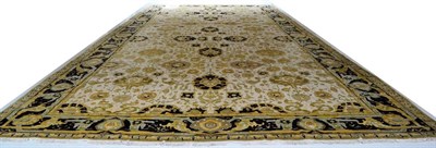 Lot 1668 - Large carpet of Agra design, probably North Afghanistan, the ivory field with an allover design...