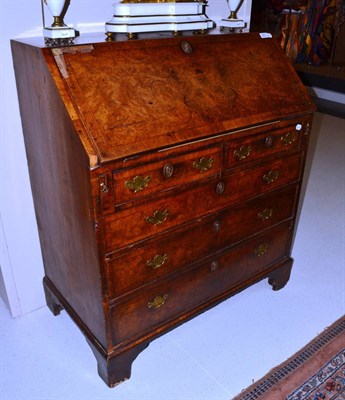 Lot 1675 - George II burr walnut bureau, with two keys