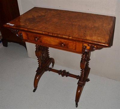 Lot 1676 - A Victorian walnut writing table with fold-over top