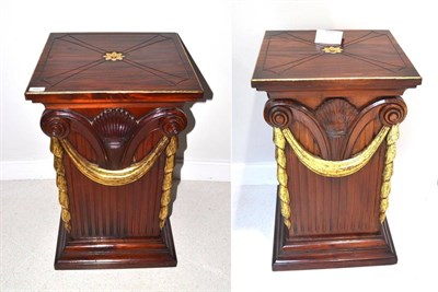 Lot 1683 - A pair of gilt and mahogany pedestals