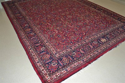 Lot 1685 - Good Mashad carpet, Khoresan Province, the raspberry field with an allover design of scrolling...