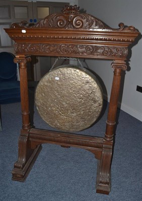 Lot 1692 - A late Victorian carved dinner gong on stand