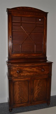 Lot 1695 - A Regency mahogany secretaire bookcase, with single astragal glazed door enclosing shelves,...