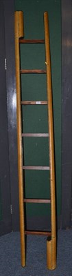 Lot 1700 - A close nailed leather set of folding pole ladders