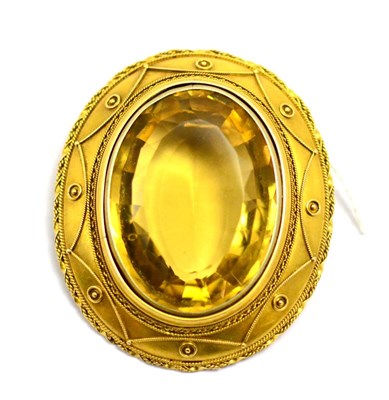 Lot 1 - # A Victorian brooch/pendant set centrally with a large oval mixed cut citrine, within a rope twist