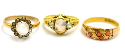 Lot 24 - # A Victorian opal and diamond three stone ring, in a scroll setting on a plain polished shank,...