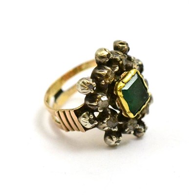 Lot 49 - # An emerald and diamond star effect cluster ring, the emerald-cut stone framed by rose cut...