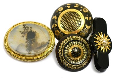 Lot 73 - # Four brooches, including; two tortoiseshell pique brooches, one 3.2cm in diameter, one 3.8cm...
