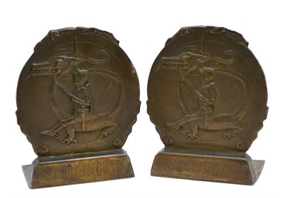 Lot 77 - A pair of bronze bookends depicting Saint George and the dragon, height 23cm