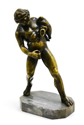 Lot 78 - A late 19th century bronzed figure of a fawn, modelled with a wine skin over one arm pouring...