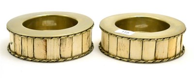 Lot 115 - Anthony Redmile, A pair of whalebone and plated circular bottle coasters, circa 1970s, each stamped