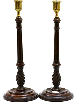 Lot 116 - A pair of George III walnut fluted candlesticks (a.f.), height 38cm