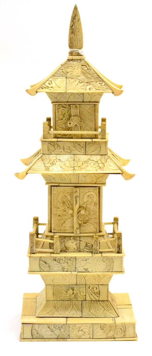 Lot 128 - A late 19th/early 20th century carved ivory shrine in the form of a temple, height 35cm