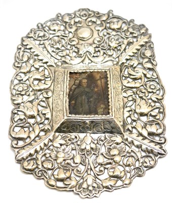Lot 130 - An Indo Portuguese pierced silver frame enclosing an oil on metal portrait of a saint, the...
