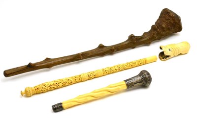 Lot 139 - Three various early 20th century ivory and bone parasol/walking stick handles and a rootwood...
