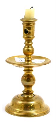 Lot 140 - A mid-17th century Dutch Heemskerk candlestick, with turned and knopped stem, raised on a bell...