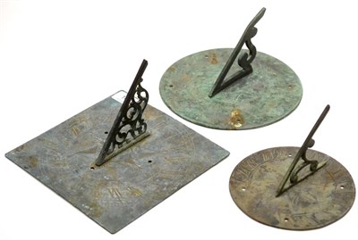 Lot 148 - A circular bronze sun dial the border engraved with Roman numerals, a smaller example engraved with