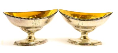 Lot 149 - A pair of white metal pedestal salts (unmarked) with gilt interiors