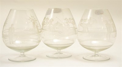 Lot 161 - Three balloon brandy glasses etched with sporting subjects, height 15.5cm