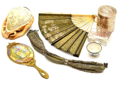 Lot 181 - A mother-of-pearl handled fan, a gilt metal hand mirror, a miniature enamel bowl, etc