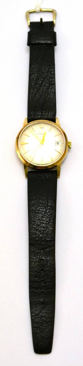 Lot 188 - A 9ct gold automatic centre seconds calendar wristwatch, retailed by Garrard, 1974, lever movement