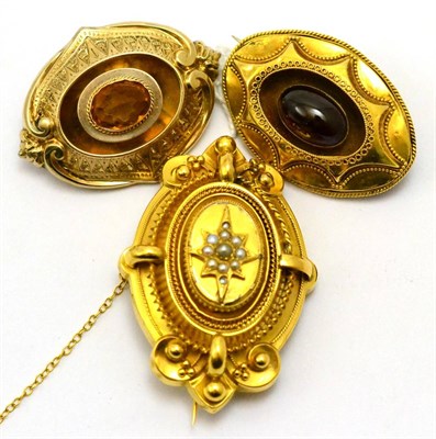 Lot 204 - # Three Victorian brooches, including; one set with an oval cabochon garnet, one set with a...