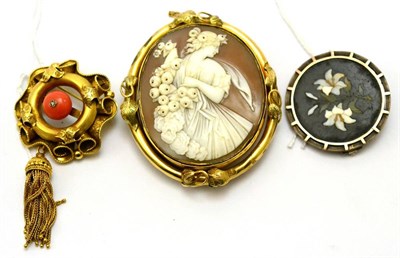 Lot 211 - # Three Victorian brooches; a cameo brooch depicting a maiden with flowers, in a vine leaf...