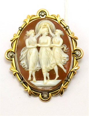 Lot 231 - # A cameo brooch depicting the Three Graces within a diamond set frame, with leaf decoration,...